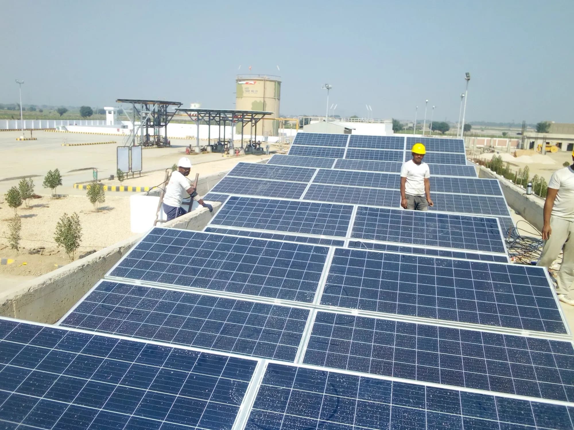 Solar panels being installed across a flat terrace
